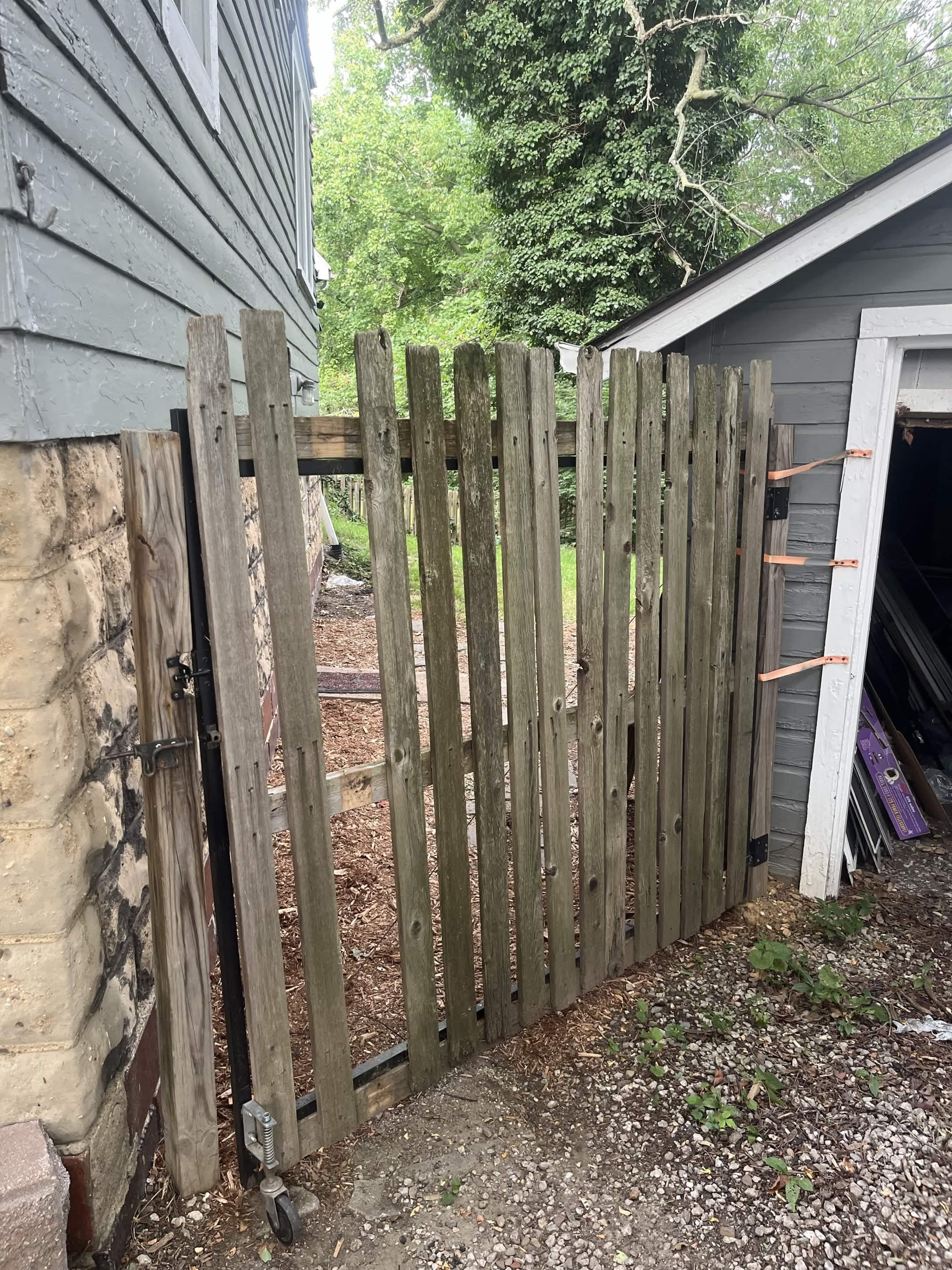 Older wood side-yard gate before replacement work